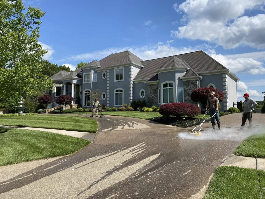 Pressure washing concrete driveway for a clean and polished look